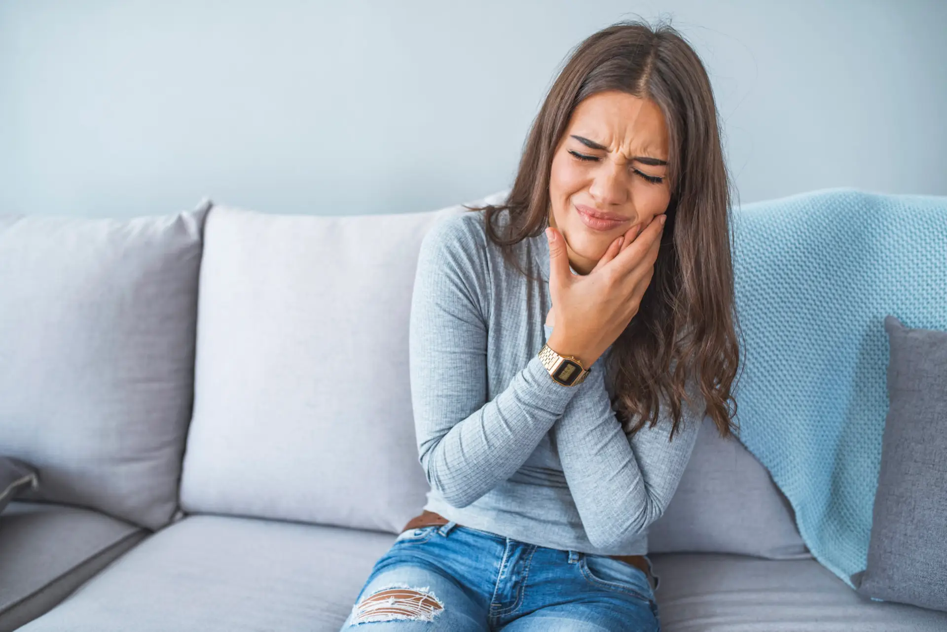 Patient with tooth pain visiting Olympic Park Smiles Dental for root canal treatment in Calgary
